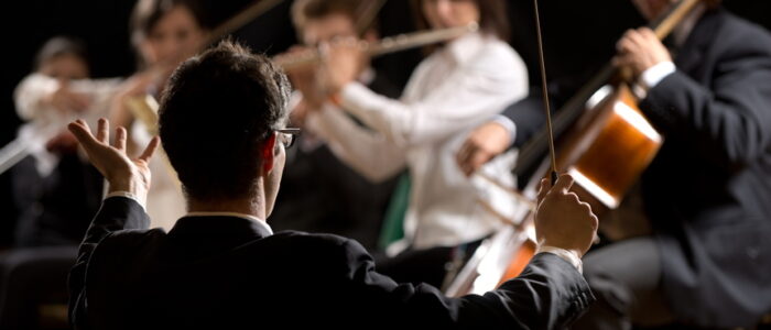 Conductor directing symphony orchestra